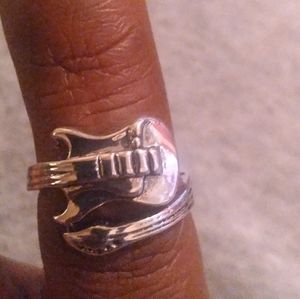 Size 7 guitar ring but can be open to 9
